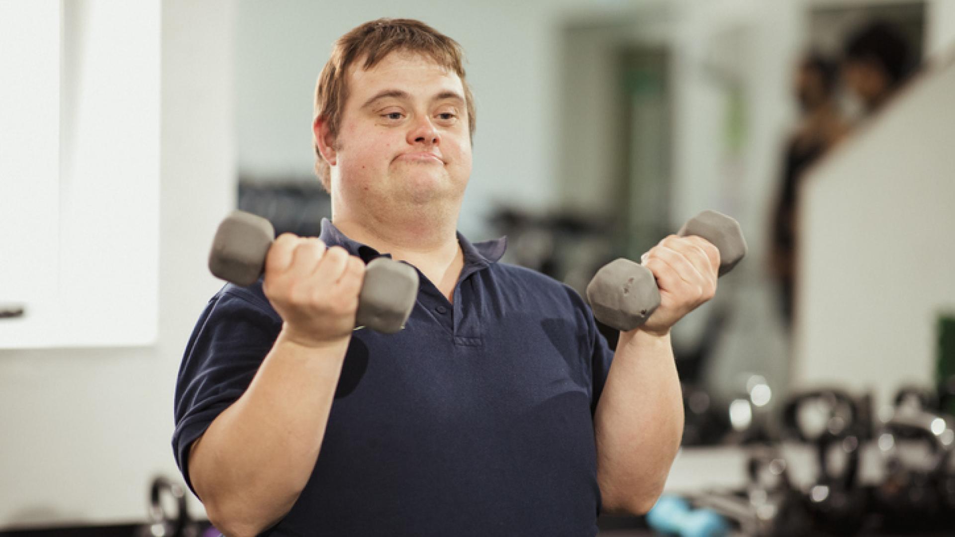 Adult with down syndrome lifting weights